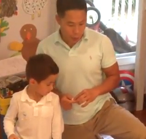 Father explains how to play Playtime Bowling using Playtime Sheets.
